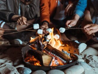 People roasting marshmallows over a campfire
