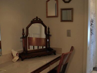 Image of the Rose Room Bathroom with Antique Mirror and Tub
